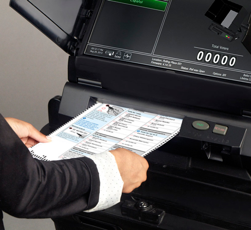 Voter inserts ballot into ImageCastEvolution Machine